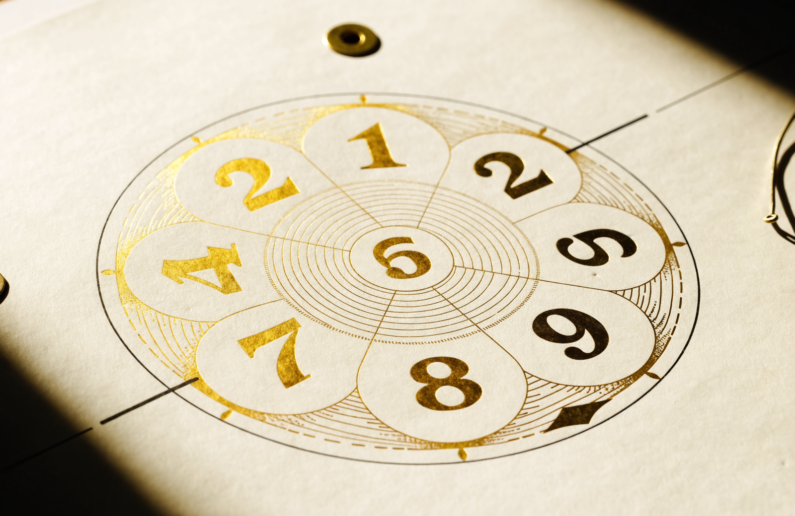 Printed Numera keepsake — a personal-year numerology wheel and lucky-dates calendar.